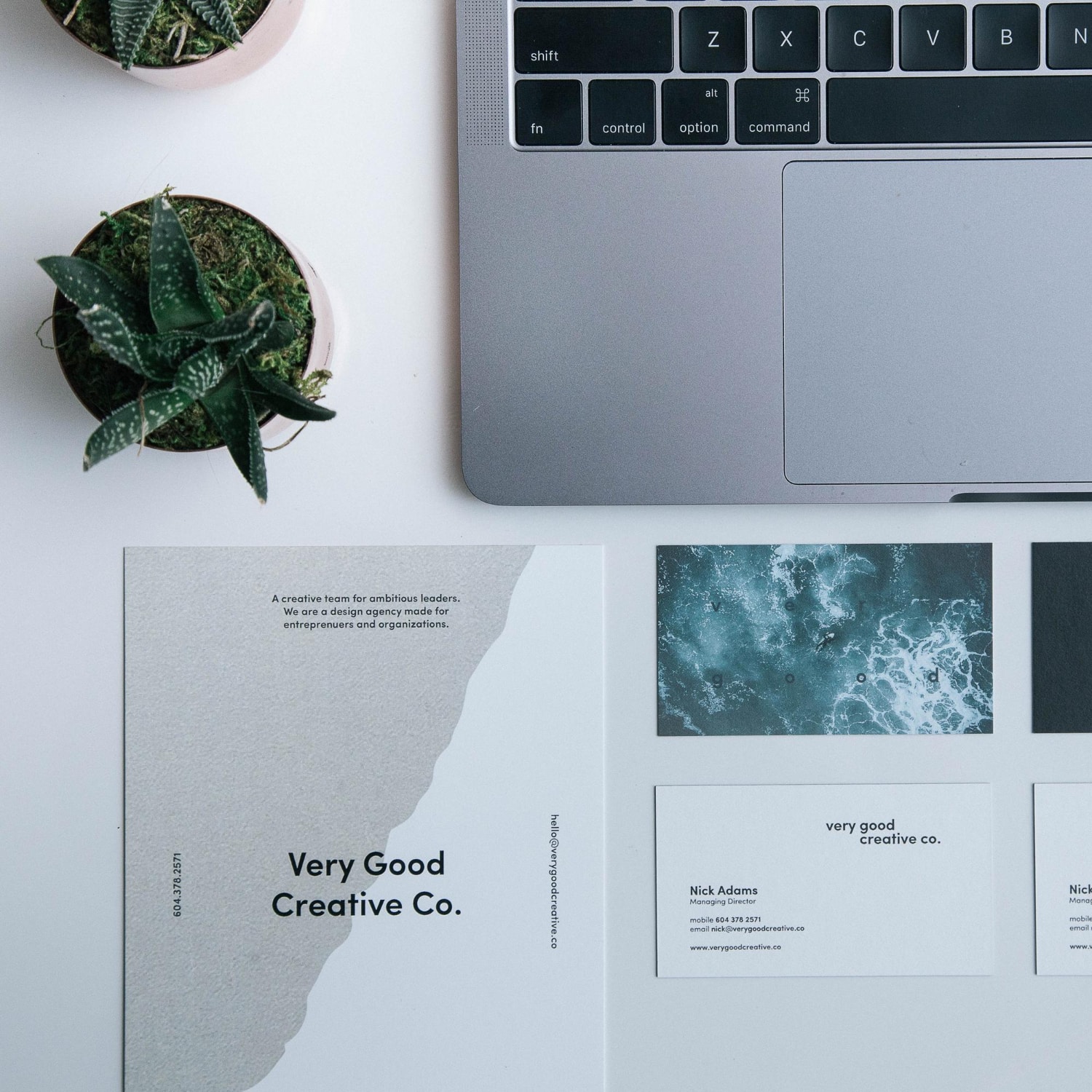 laptop with book that says good good art