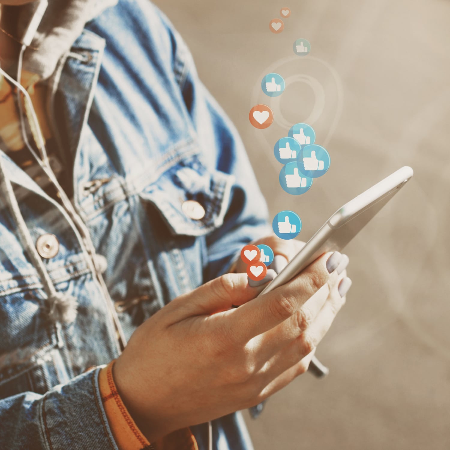 young woman watches live stream while walking down city street
